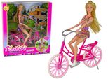 Bambola Su Una Bicicletta Rosa