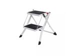 In And Outdoormatch Kennith Gradino Pieghevole - Con 2 Gradini - Scaletta - Gradino Largo 20 Cm - Antiscivolo - Tappetino In Gomma - Con Maniglia Di Trasporto - Portata Fino A 150 Kg - In Acciaio - Tv Gs - Bianco/Nero