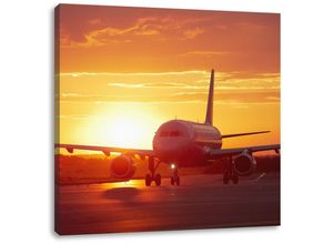 Pixxprint Leinwandbild Flugzeug im Sonnenuntergang