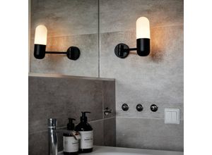 PR Home bathroom wall light Zeta, black, IP44, swivelling