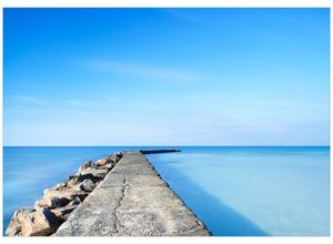 Wallario Wandbild, Pier am blauen Ozean mit blauem Himmel