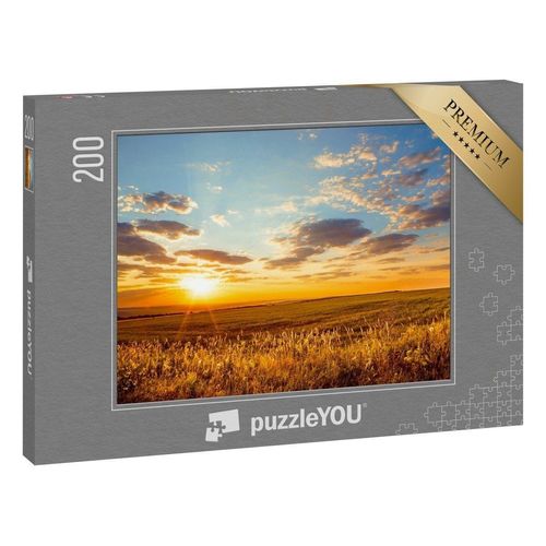 puzzleYOU Puzzle Goldene Morgendämmerung über endlosen Feldern