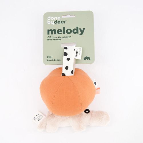 Orangefarbenes Musikspielzeug in Form eines Krokodils