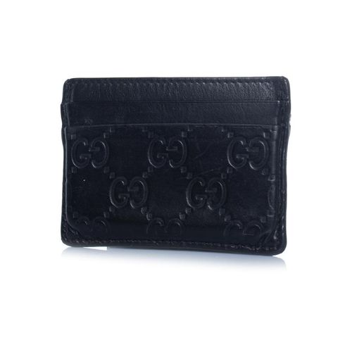 Gucci kaarthouder van zwart leer met monogramreliëf.